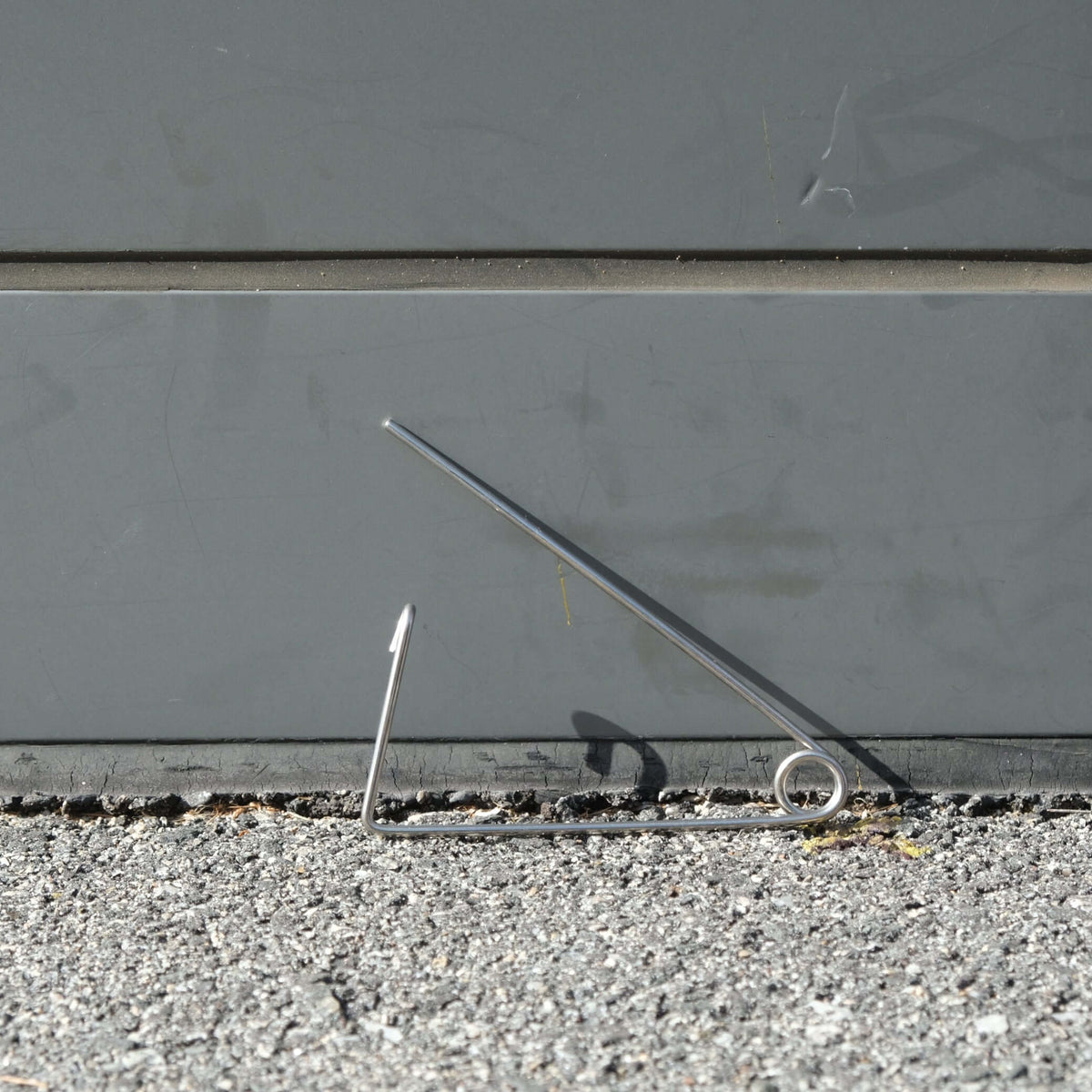 CRAB BAIT CLIP 150MM S/S on a surface, designed for securing crab bait.
