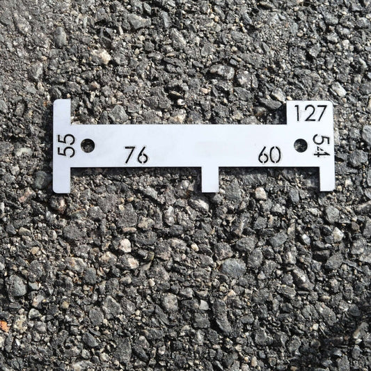 MULTI GAUGE 127/76/60/55/54MM professional fishing measurement tool on asphalt surface.