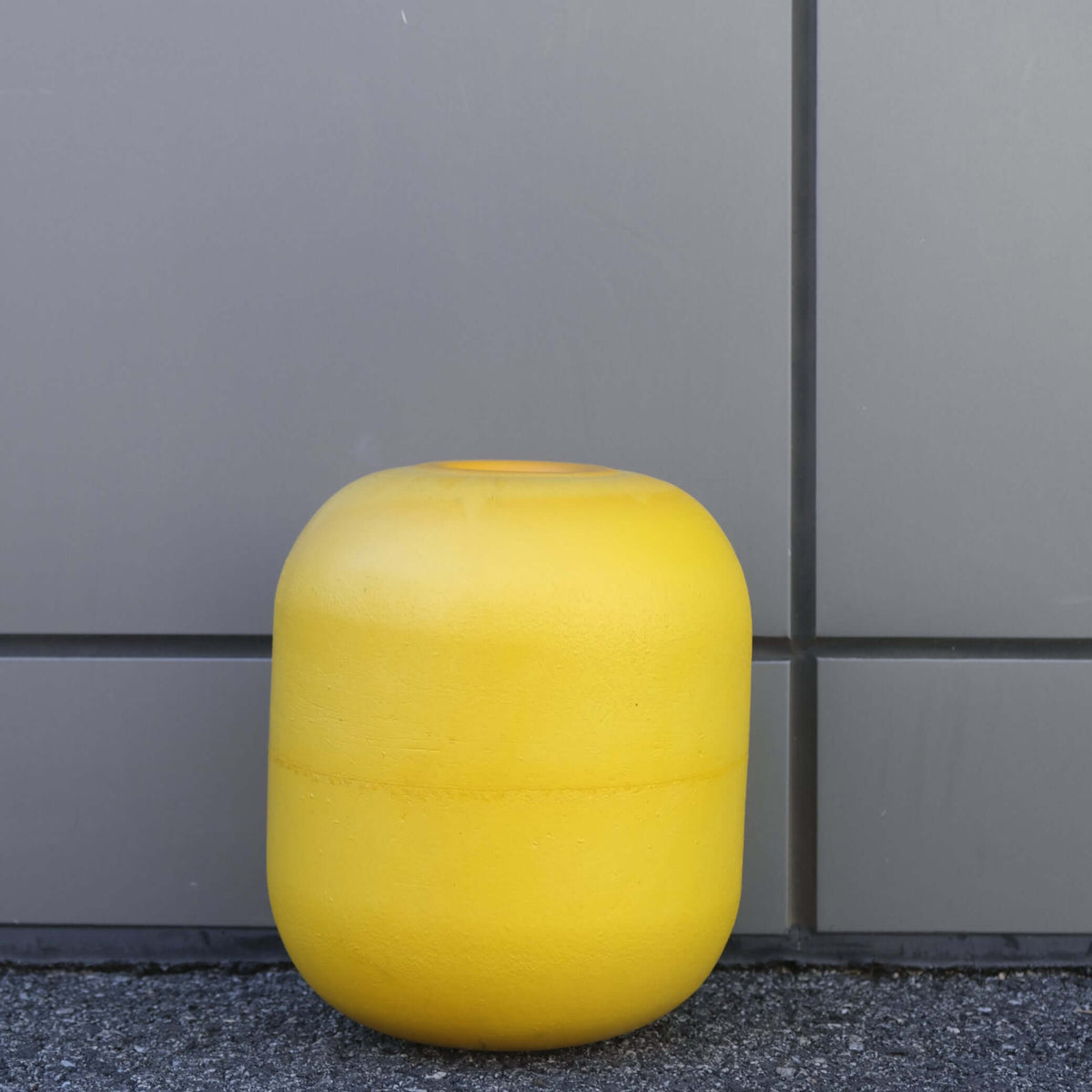 FLOAT EVA DF-70, 250MM X 225MM yellow buoyancy float against a gray wall.