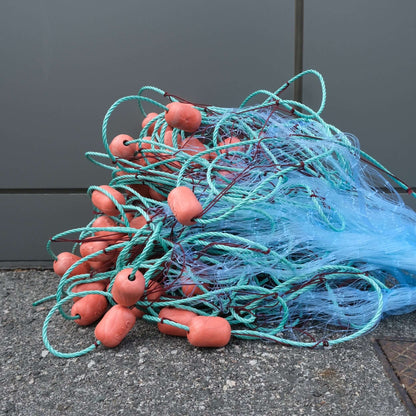 Haul Net L7 2-3/4" 25MD 30M with mesh and floats, ideal for fishing in coastal areas.