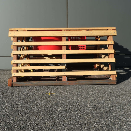 3/4 POT SB JR/PI 1 BASKET wooden crate with steel base and red basket.