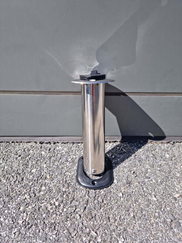 VERTICAL ROD HOLDER WITH CAP mounted on a surface, showcasing its sleek stainless steel design.