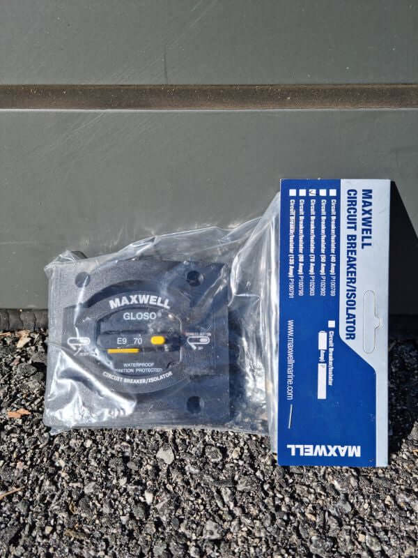 MAXWELL 70 AMP CIRCUIT BREAKER displayed in packaging on a textured surface.
