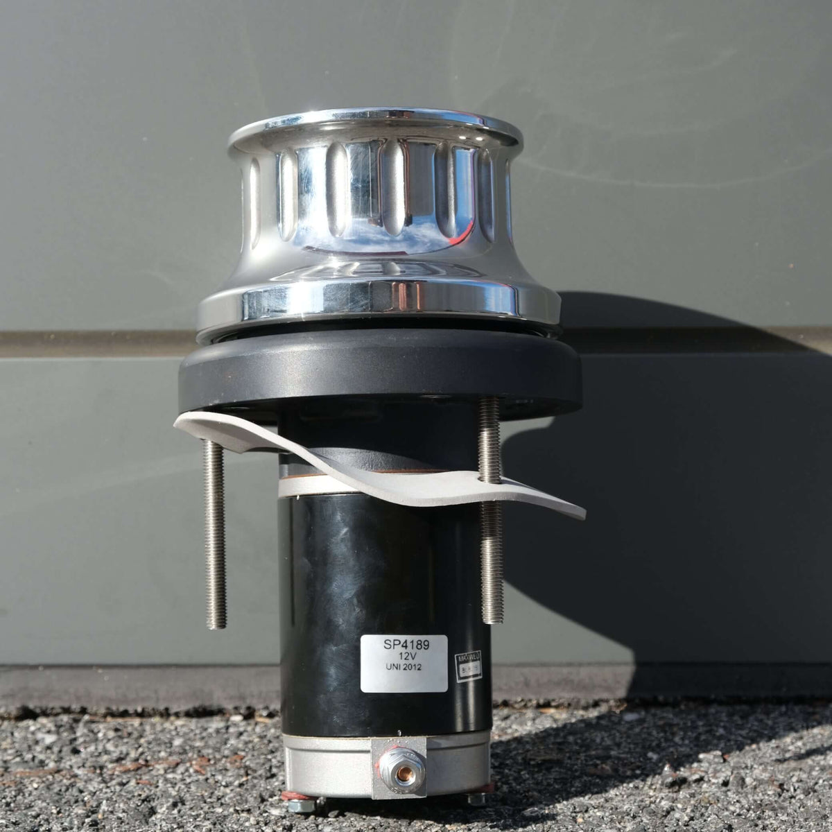 Image of a WINCH ANCHORMAX 12V F/S with chrome top and black base, designed for cray pot pulling.