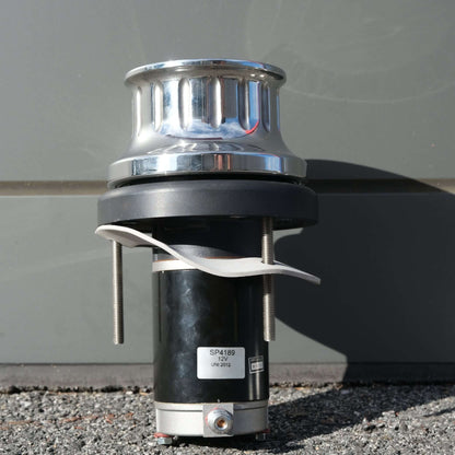 Image of a WINCH ANCHORMAX 12V F/S with chrome top and black base, designed for cray pot pulling.