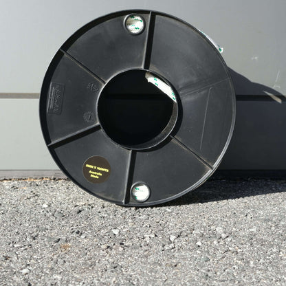 ROPE DB BRAID 8MM X 100M spool on asphalt surface, showcasing high-quality Australian-made material.