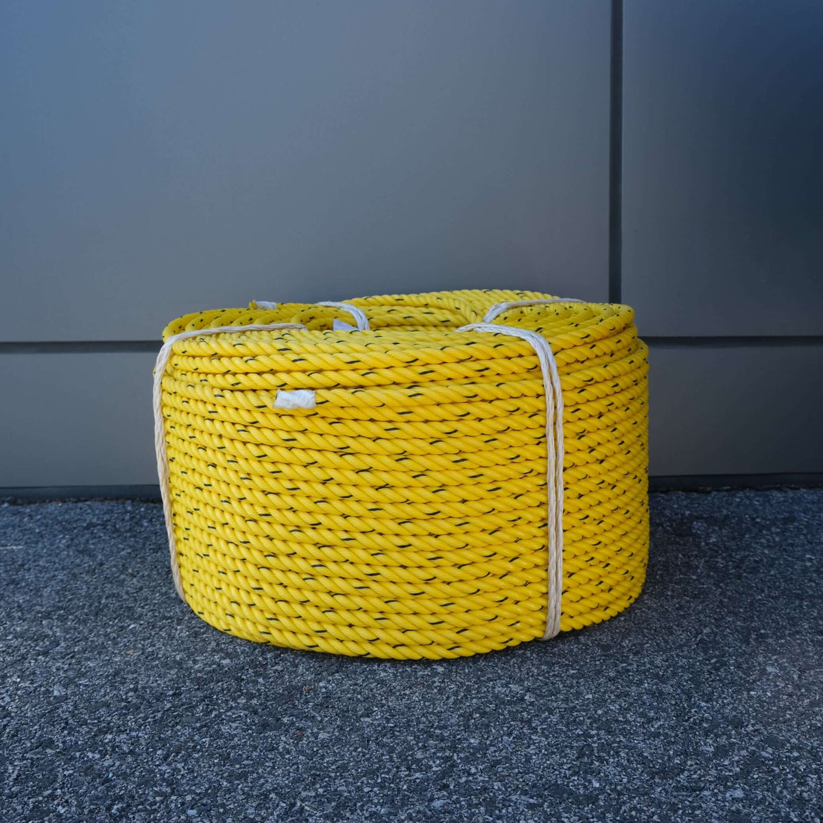 ROPE PE 11MM X 220M YELLOW/BLK storage basket made of durable yellow PE rope.