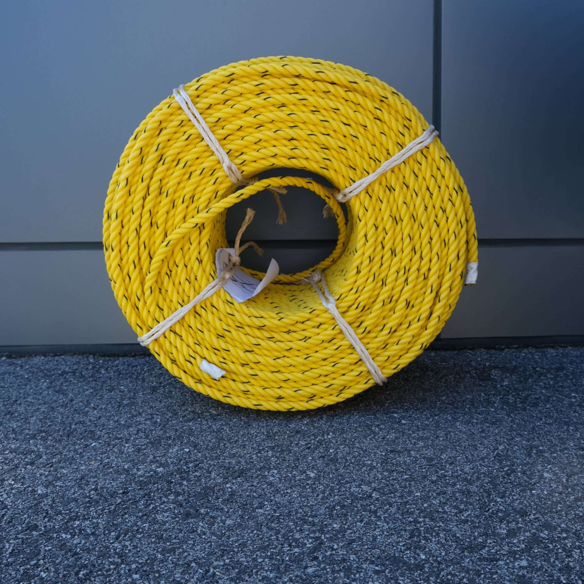 ROPE PE 11MM X 220M YELLOW/BLK rolled yellow poly rope displayed on a gray background.
