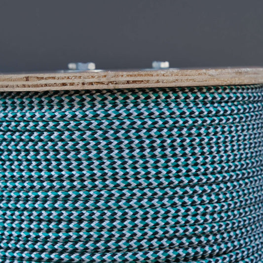 ROPE BR LEADCORE 5MMX200M 45G: Close-up of braided lead core rope with turquoise and black colors.