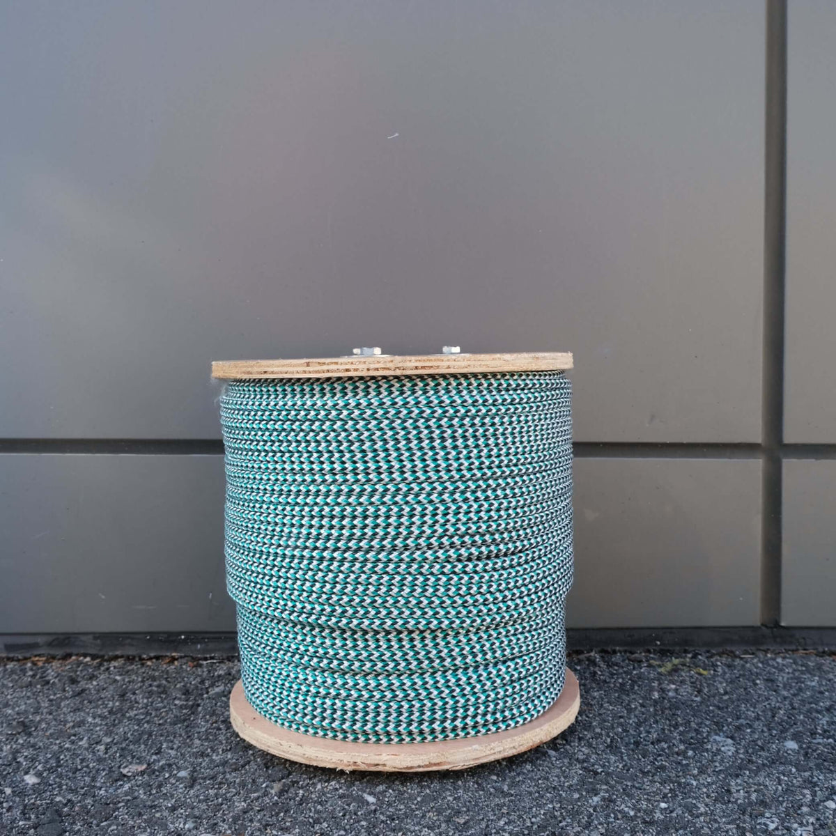 ROPE BR LEADCORE 5MMX200M 70G on a wooden spool, showcasing durable braided design for commercial fishing.