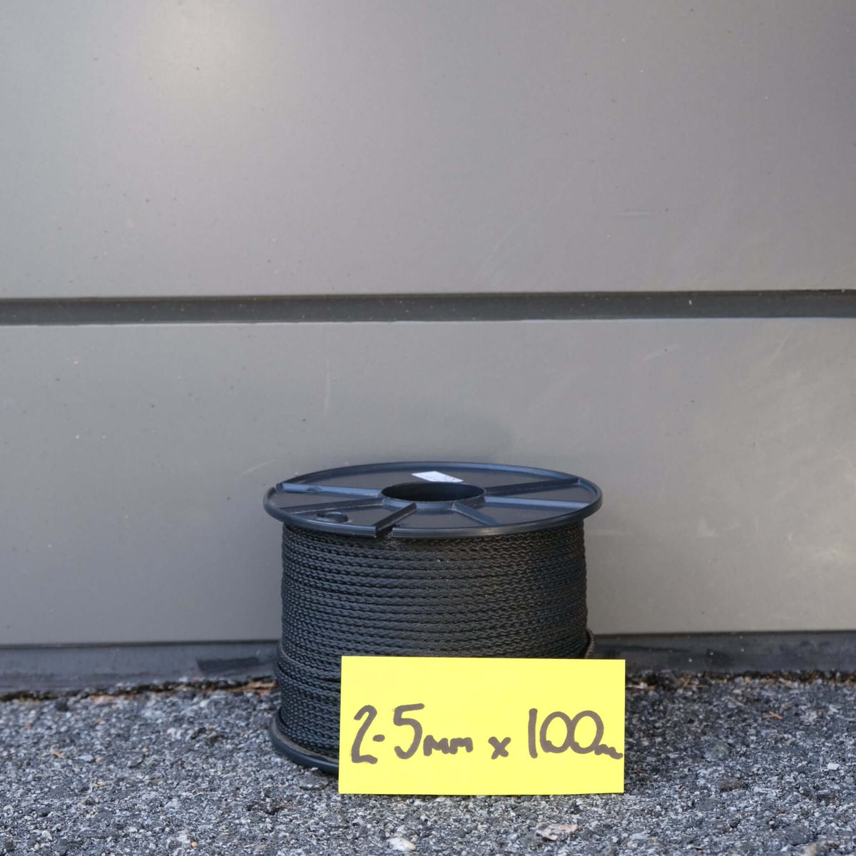 VB CORD 2.5MM X 100M BLACK on spool, showcasing strong and durable UV treated polyester construction.