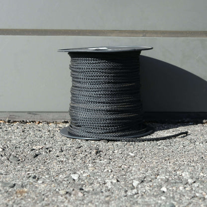 VB CORD 2.5MM X 100M BLACK on a spool, featuring durable UV treated polyester for strong applications.
