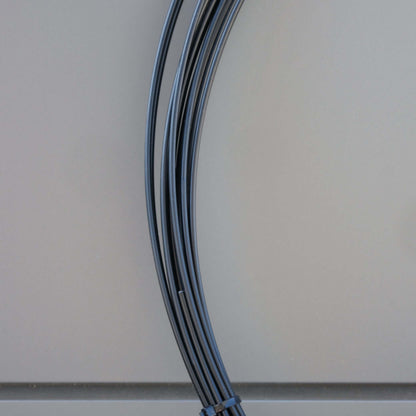 WIRE PVC COATED 3.15MM X M BLK close-up of black PVC coated wire suitable for connecting nets and shade cloth.